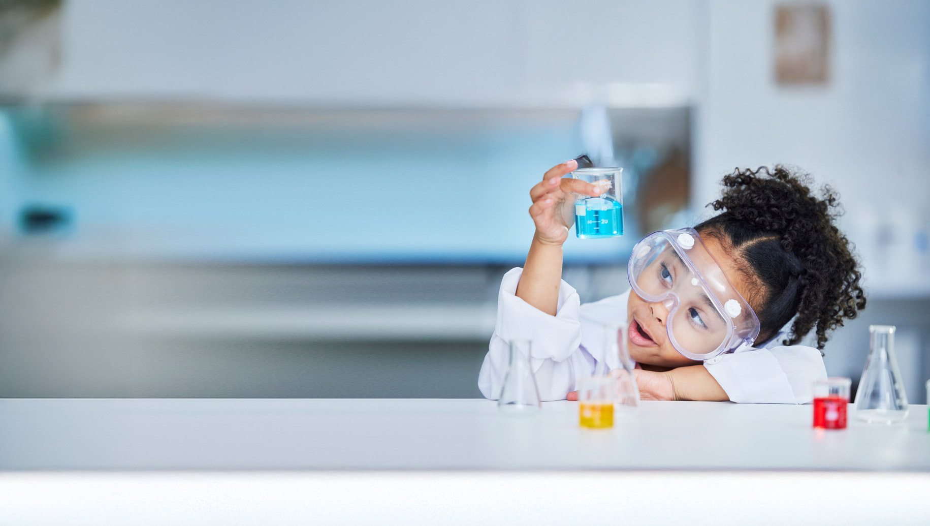 Coasterra_Education_Girl with beaker